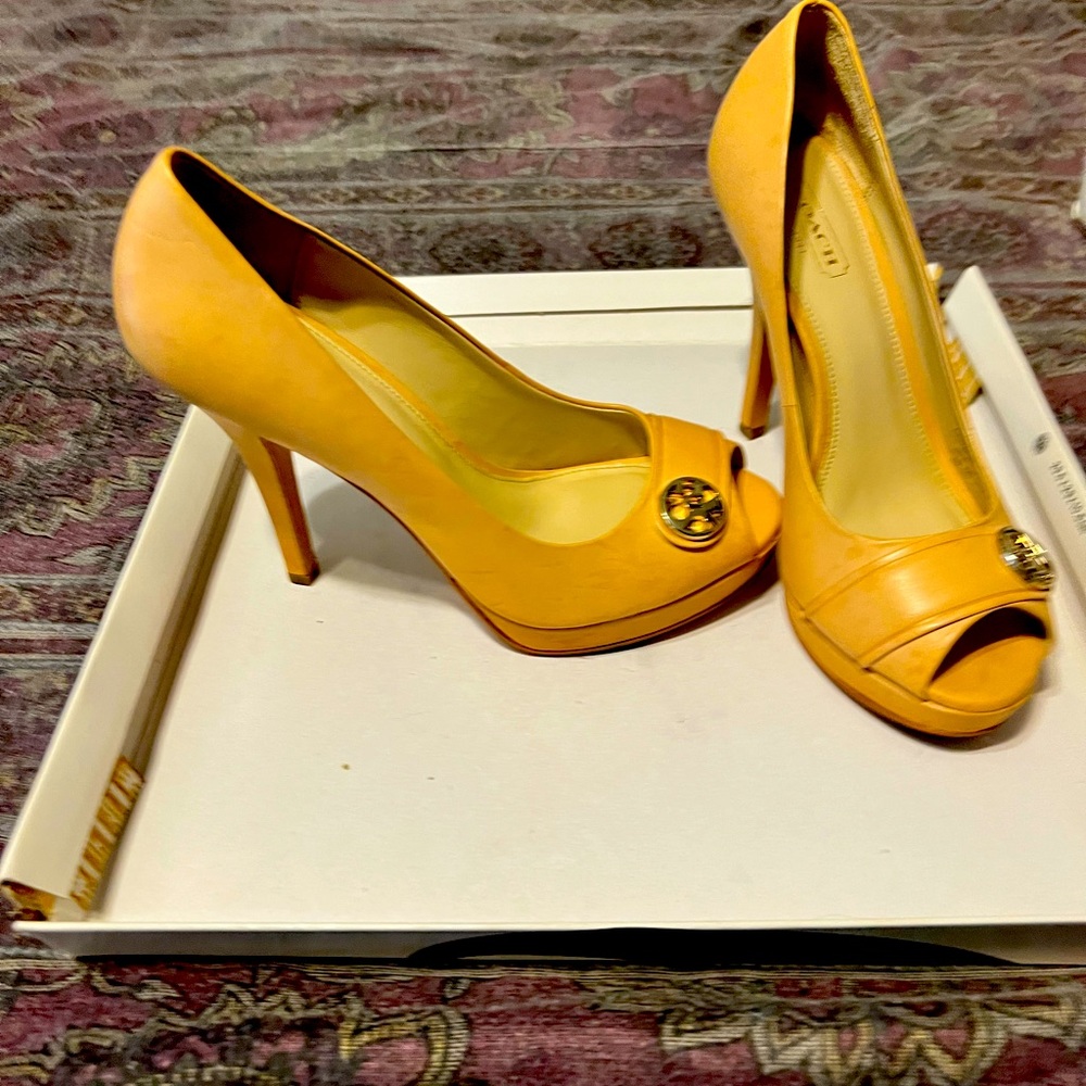Beige pair coach leather heels used once